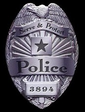 police badge serve and protect-cropped