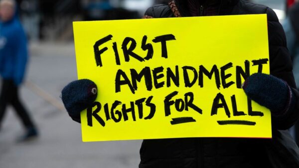 protest sign reads First Amendment Rights for All