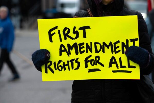 protest sign reads First Amendment Rights for All