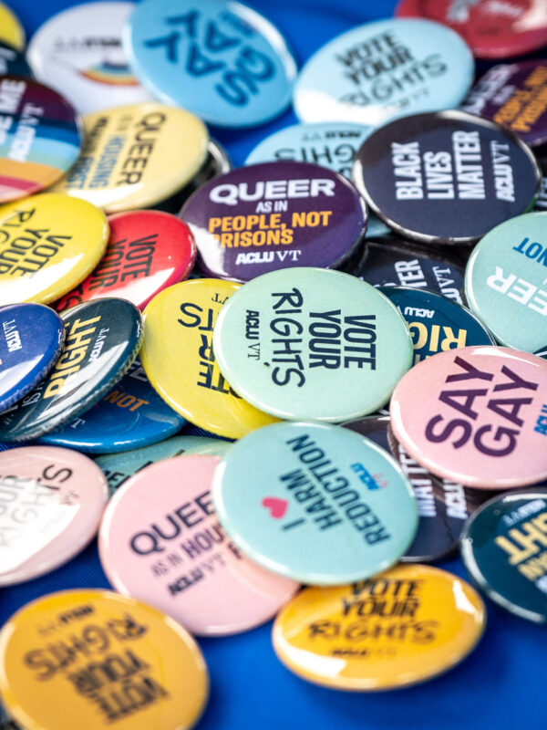 ACLU-VT buttons on table at an event
