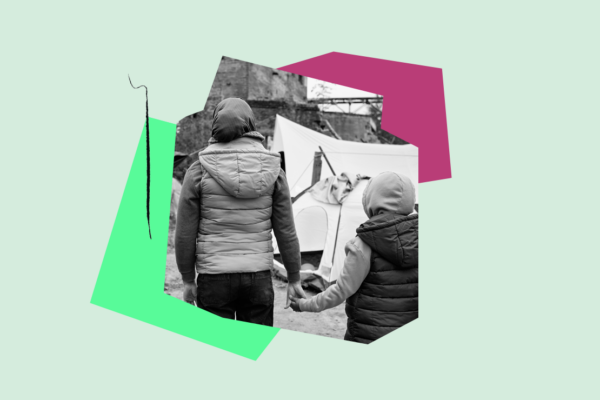 parent with child holding hands and homeless by a tent outisde