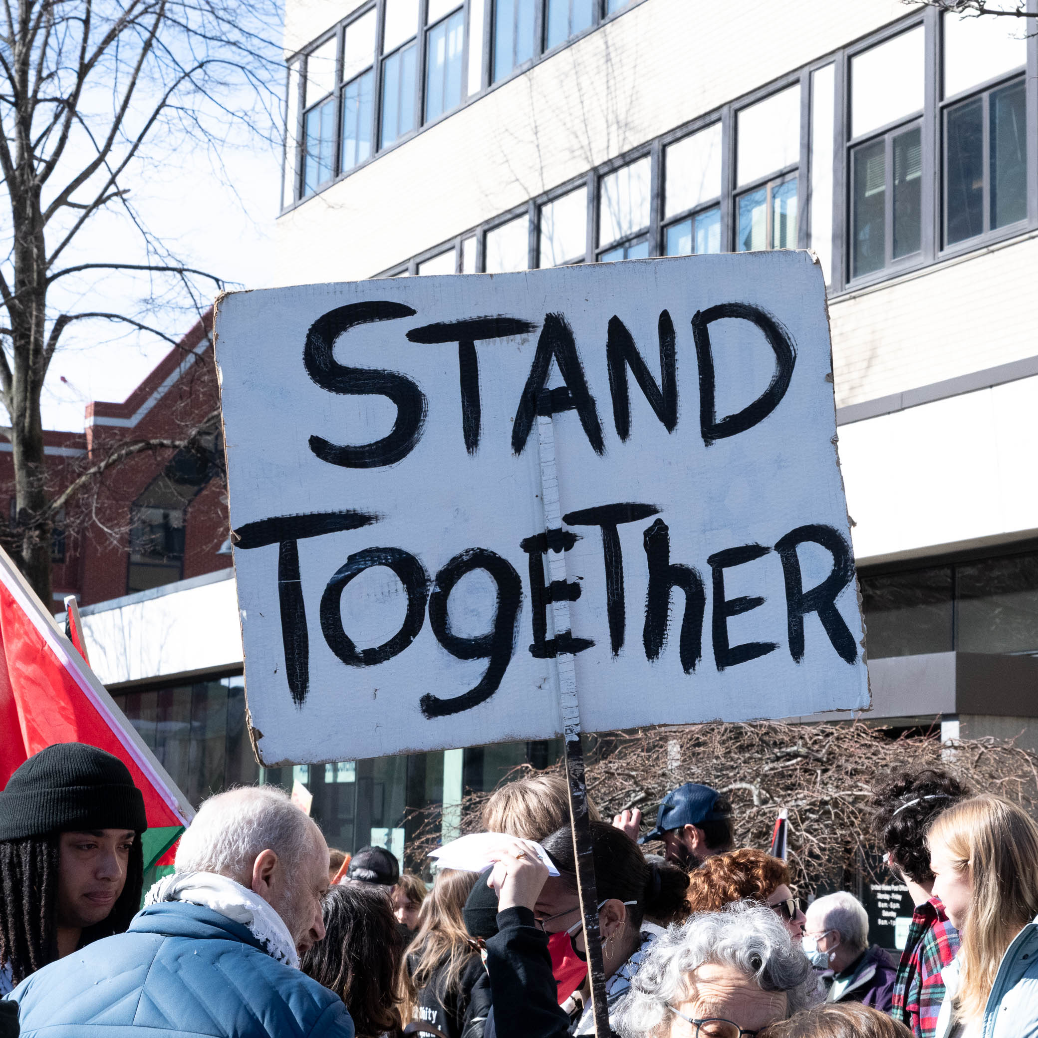 protest poster reads Stand Together