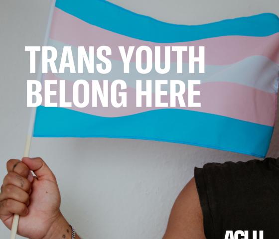 trans youth belong here over photo of person holding a trans pride flag